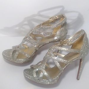 Michael Kors silver high heel glittery shoes.